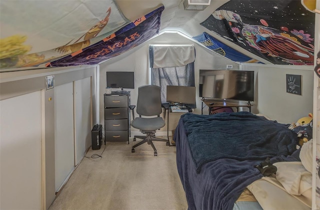 bedroom featuring lofted ceiling and light carpet