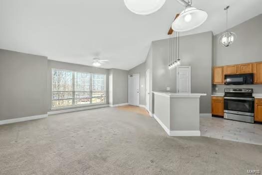 kitchen featuring stainless steel electric stove, light colored carpet, light countertops, open floor plan, and black microwave