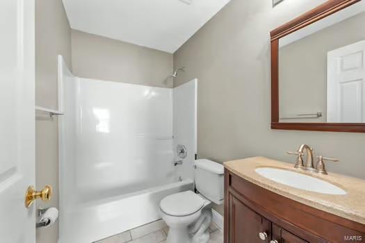 bathroom with  shower combination, toilet, and vanity