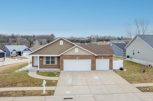 view of front facade with a garage, a residential view, brick siding, and a front lawn