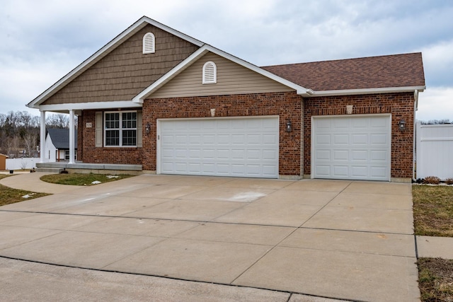 view of front of property with a garage, concrete driveway, brick siding, and a shingled roof