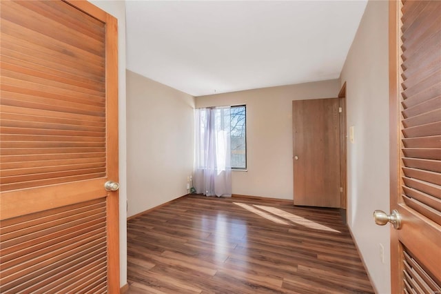 empty room featuring wood finished floors