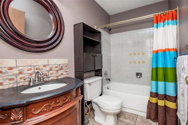 bathroom featuring vanity, shower / bath combo, tile patterned flooring, and toilet