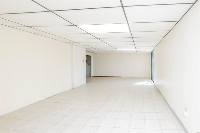 finished basement featuring a drop ceiling