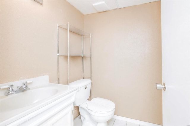 bathroom featuring vanity, toilet, and tile patterned floors