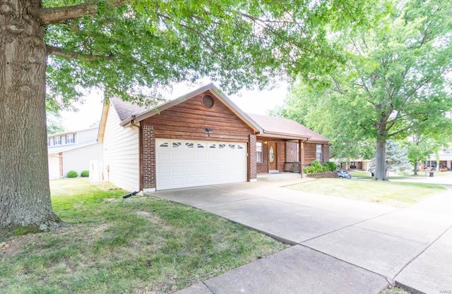 ranch-style house with a front lawn, concrete driveway, brick siding, and an attached garage