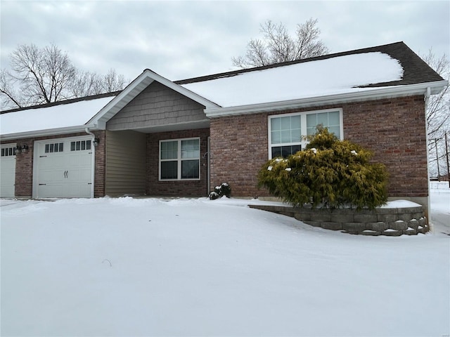 single story home with brick siding and an attached garage