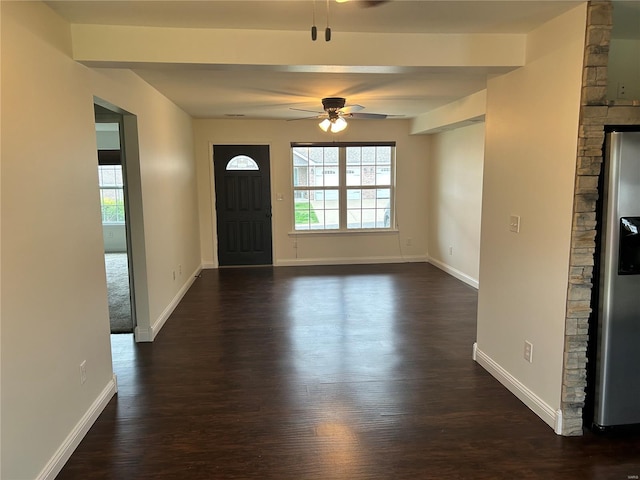 foyer featuring dark wood-style flooring, baseboards, and ceiling fan