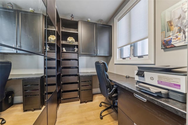 home office with light wood finished floors