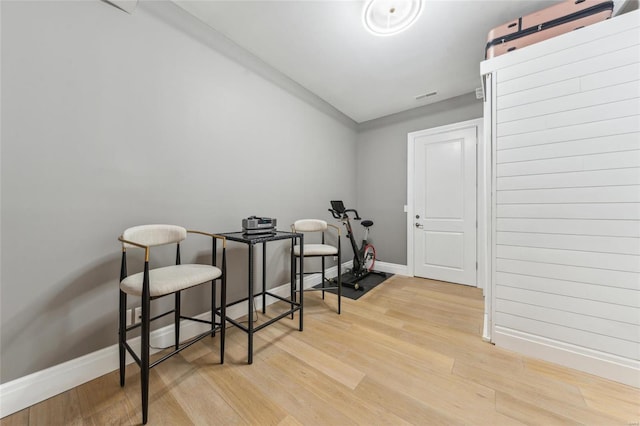 misc room with visible vents, baseboards, and light wood-type flooring