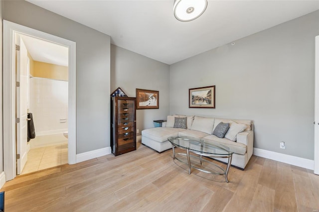 living room featuring wood finished floors and baseboards