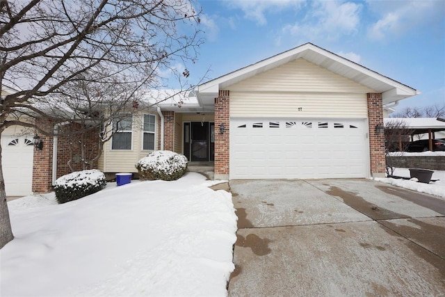 ranch-style house with brick siding, driveway, and an attached garage