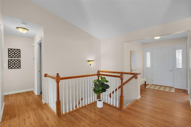 foyer with wood finished floors and baseboards