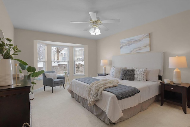 bedroom with light carpet and ceiling fan