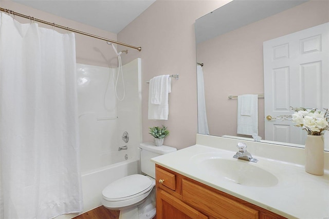 full bathroom with shower / bathtub combination with curtain, vanity, and toilet