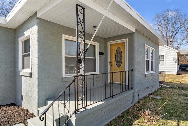 property entrance featuring concrete block siding