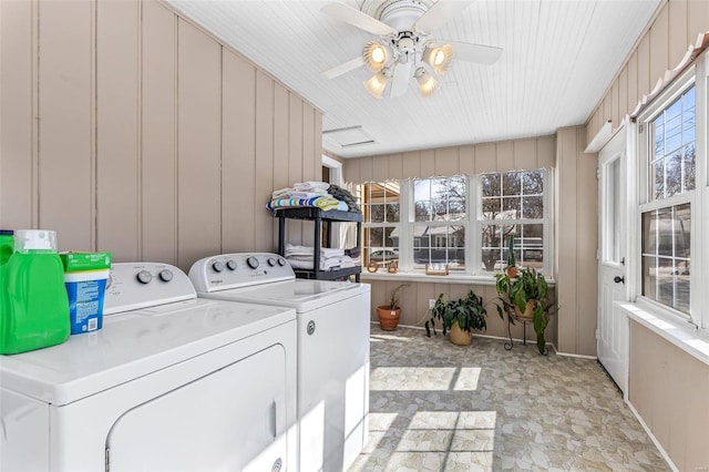 clothes washing area with washer and dryer, laundry area, and ceiling fan