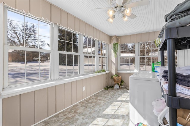 unfurnished sunroom with a wealth of natural light and a ceiling fan