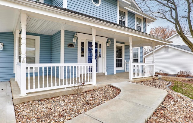 doorway to property featuring covered porch