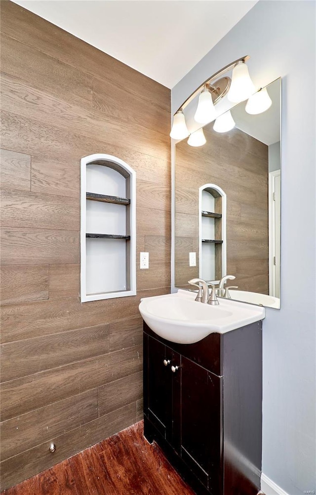 bathroom featuring wood finished floors and vanity