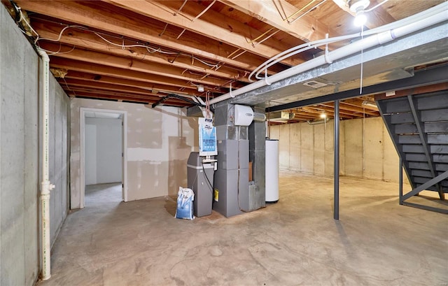 unfinished below grade area with gas water heater and heating unit