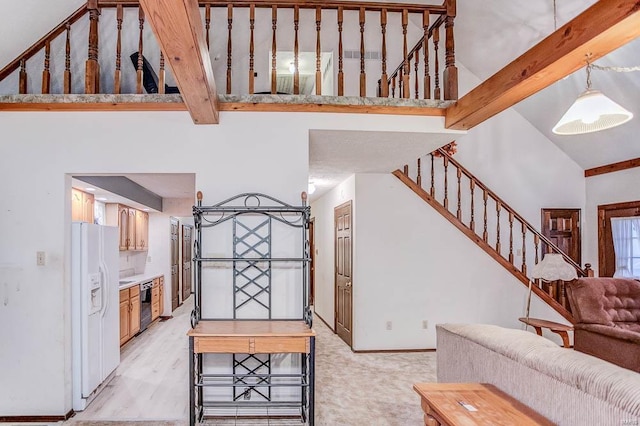 living room with high vaulted ceiling, beamed ceiling, baseboards, and stairs