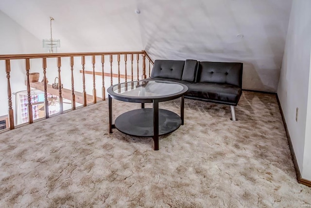 sitting room featuring carpet floors and an inviting chandelier