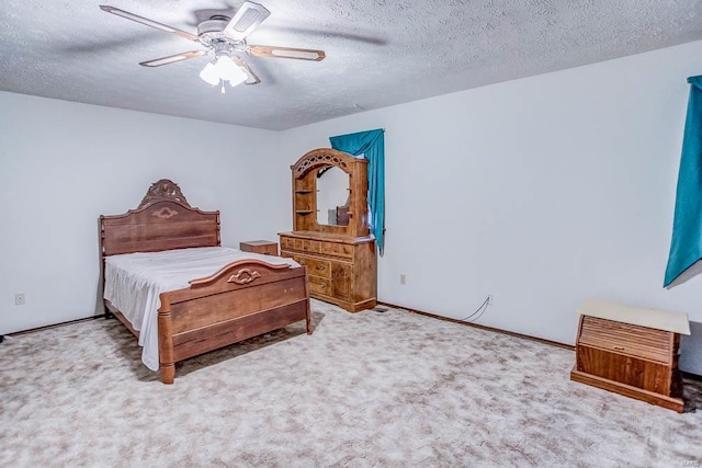 bedroom with a textured ceiling, ceiling fan, baseboards, and light colored carpet