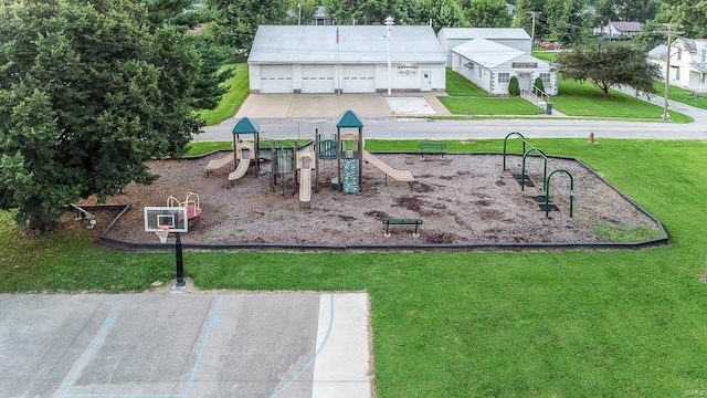 community jungle gym featuring a lawn