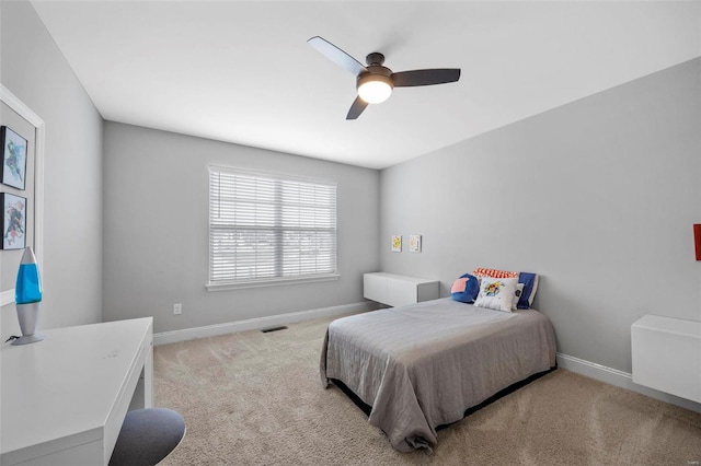 bedroom featuring visible vents, baseboards, carpet, and a ceiling fan