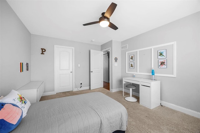 bedroom with visible vents, carpet floors, baseboards, and a ceiling fan