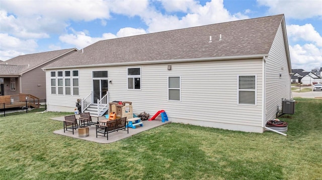 back of property with a shingled roof, fence, central AC, a yard, and a patio