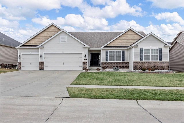 craftsman-style house with brick siding, a garage, driveway, and a front yard