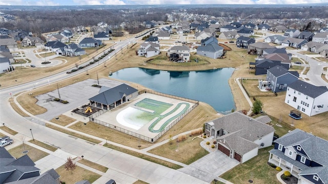 bird's eye view featuring a residential view and a water view