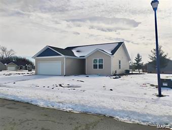 ranch-style home featuring an attached garage