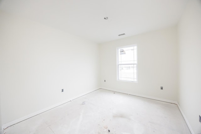 spare room featuring baseboards