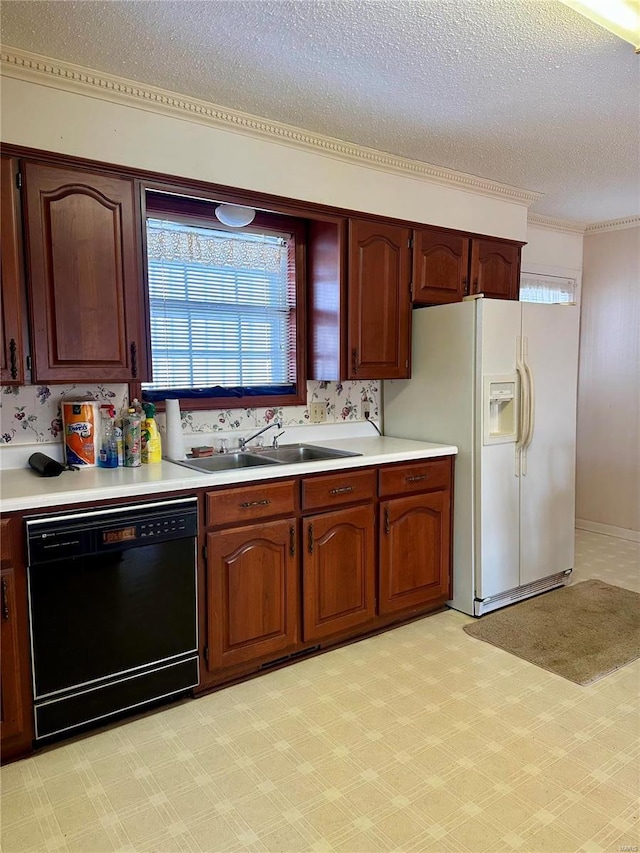 kitchen featuring dishwasher, light countertops, a textured ceiling, white fridge with ice dispenser, and a sink