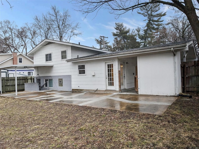 back of house featuring a patio area and fence