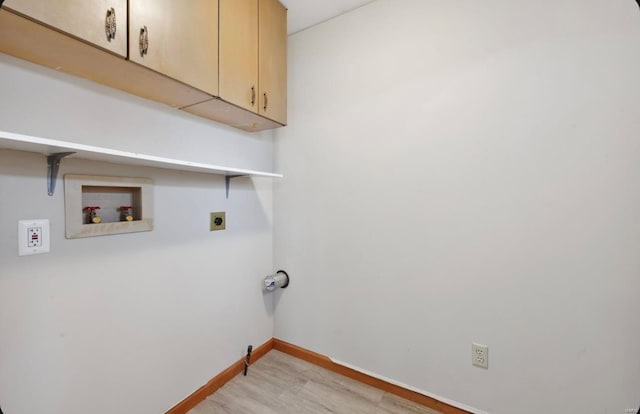 clothes washing area with electric dryer hookup, light wood-style flooring, cabinet space, baseboards, and hookup for a washing machine