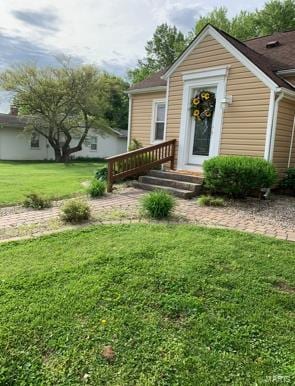 entrance to property with a yard