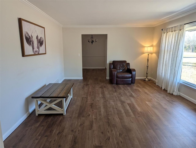 unfurnished room featuring dark wood-style floors, baseboards, a chandelier, and crown molding