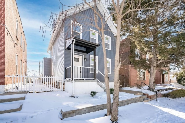 view of front of home featuring fence