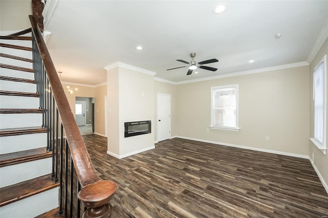 unfurnished living room featuring stairs, baseboards, dark wood-type flooring, and a glass covered fireplace