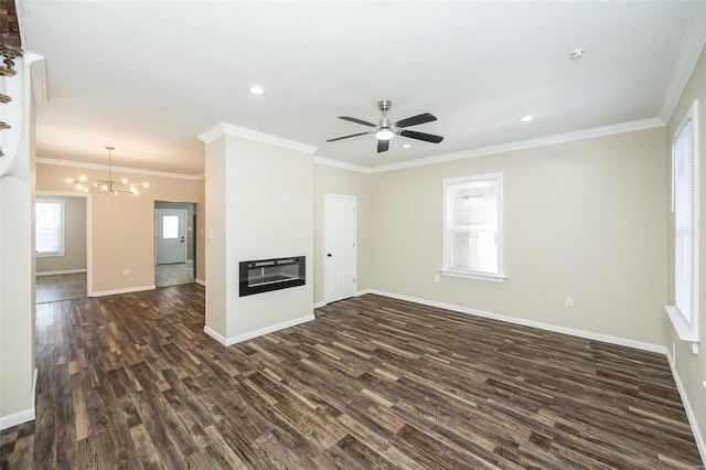 unfurnished living room featuring baseboards, a glass covered fireplace, dark wood-style floors, ornamental molding, and recessed lighting