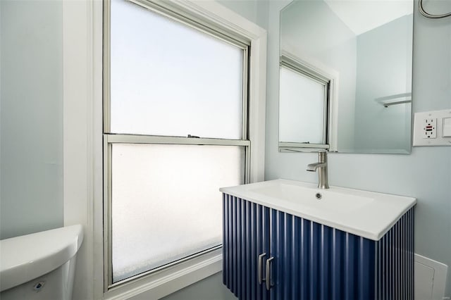 bathroom with toilet and vanity