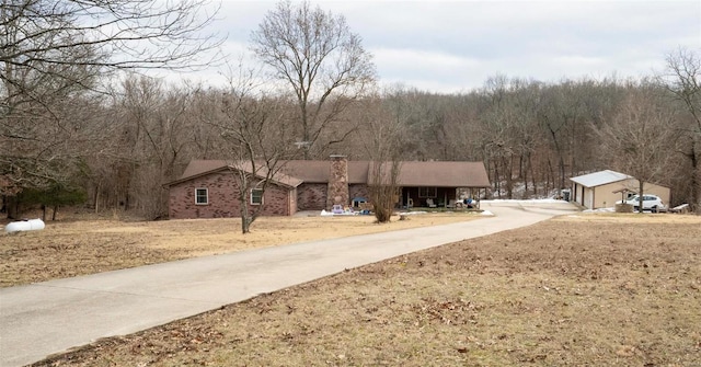 exterior space featuring a wooded view