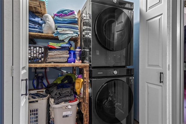 washroom with laundry area and stacked washing maching and dryer