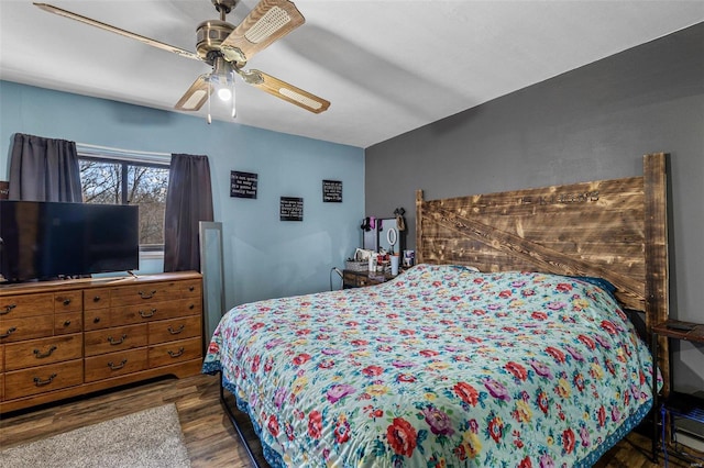 bedroom featuring a ceiling fan and wood finished floors