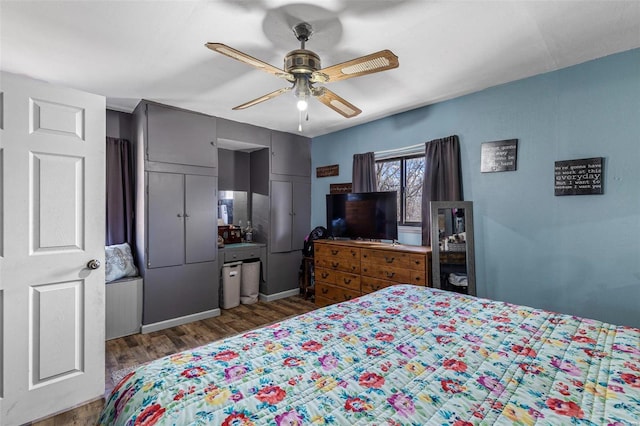 bedroom with ceiling fan and wood finished floors