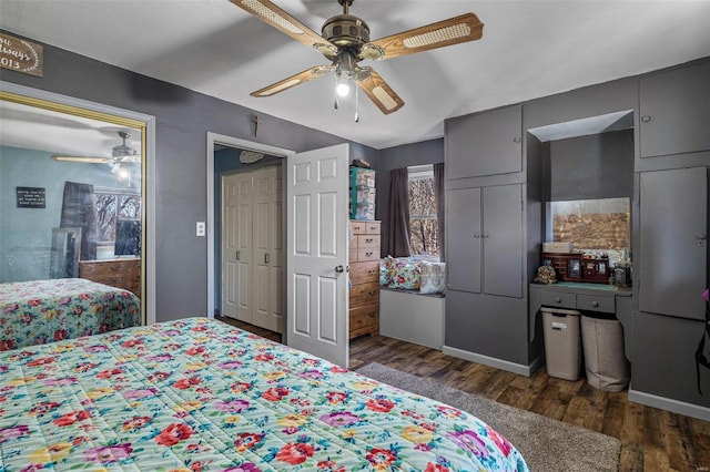 bedroom with dark wood-style floors and a ceiling fan